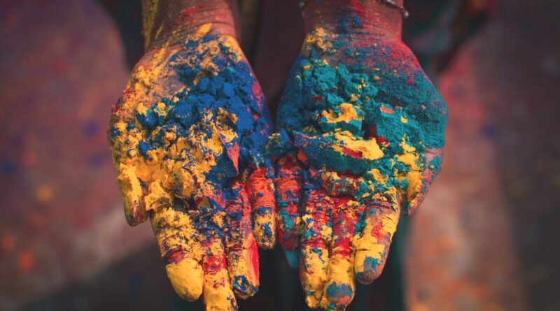 closeup photo of person holding color soils